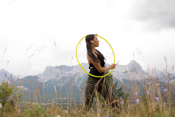 istock Native American woman dances with hoops, in mountains 941775650