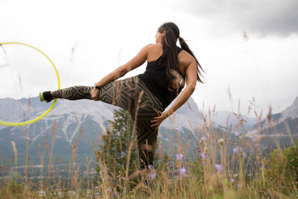 istock Native American woman dances with hoops, in mountains 941778642