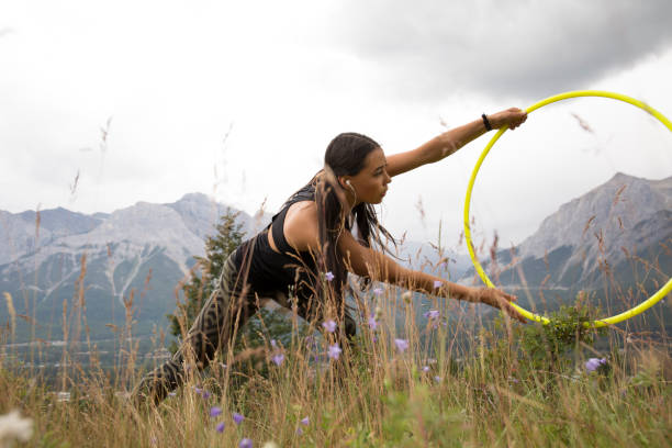 istock Native American woman dances with hoops, in mountains 941778764