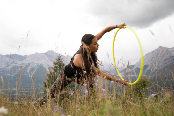 istock Native American woman dances with hoops, in mountains 941778800