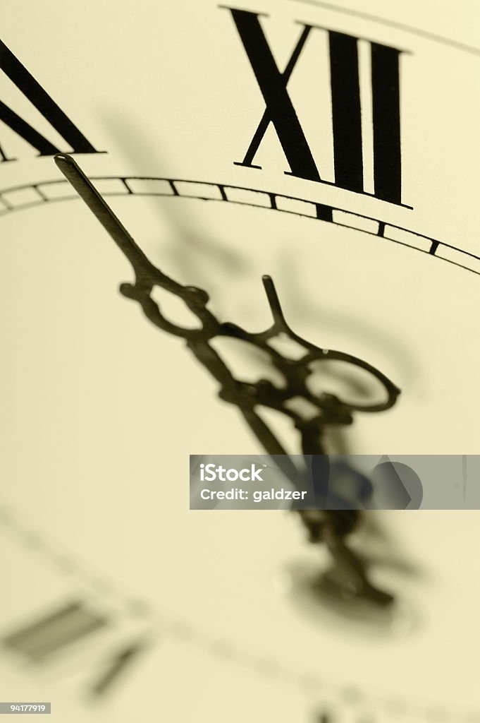 Old hours with figured arrows  12 O'Clock Stock Photo