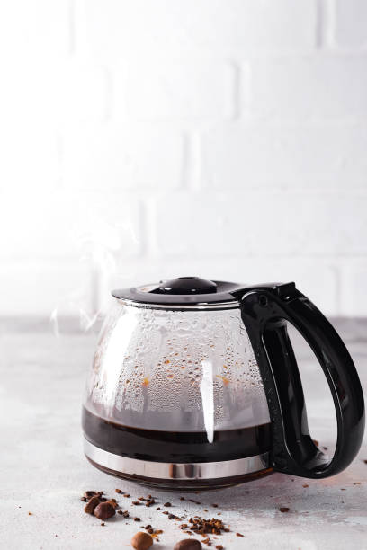 istock Coffee maker pot filling with coffee beans 941779264
