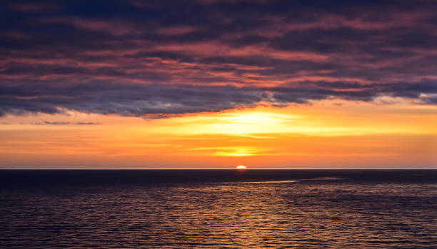 istock Sunset in the open sea with beautiful sky 941779472