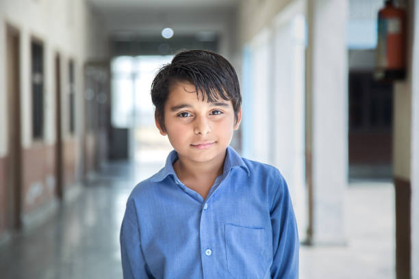 istock Portrait of a young school boy smiling 941782124