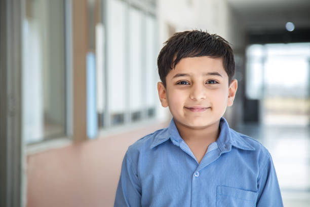 istock Portrait of a young school boy smiling 941782200