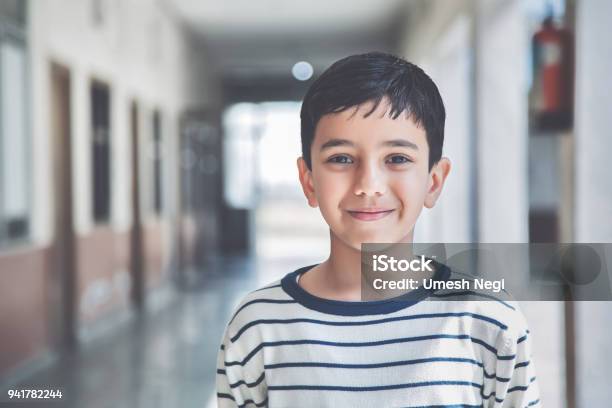 Portrait Of A Young School Boy Smiling Stock Photo - Download Image Now - Child, Boys, Indian Ethnicity
