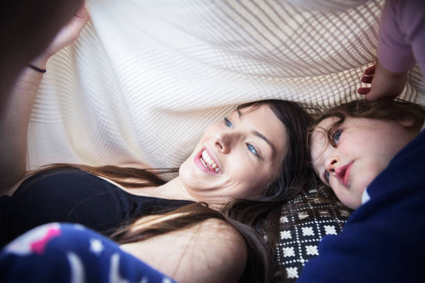 istock Mother and daughter exploring a digital tablet 941782928