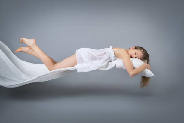 istock Sleeping girl. Flight in a dream. 941788484