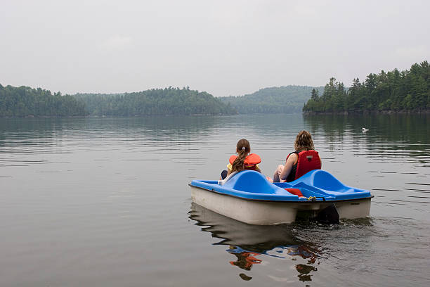 istock Mother and Daughter Paddleboating 94178904