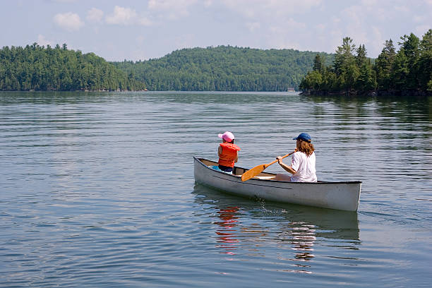 istock Mother and daughter canoeing 94178908