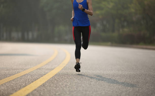 istock Fitness sportswoman running on trail 941789340