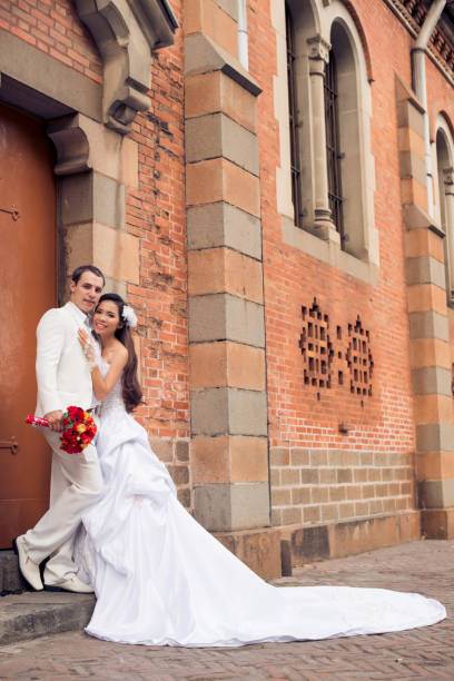 istock Adorable Wedding Couple Posing for Photography 941792764
