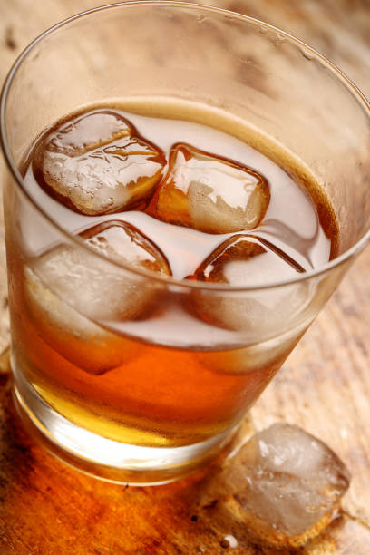 istock Cold drink with ice on vintage background 941793810