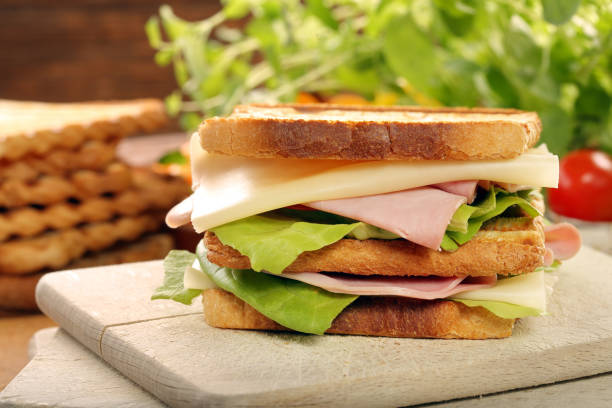 istock Fresh sandwiches with ham and cheese 941794908