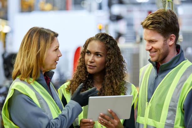 istock Mechanical engineers discussing at factory 941796852