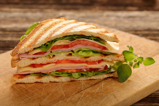 istock Fresh sandwiches with ham and cheese 941796914