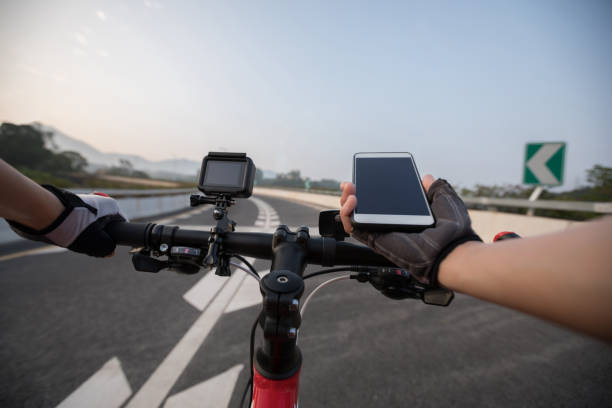 istock Cyclist using smartphone for navigation when riding mountain bike on highway 941797246