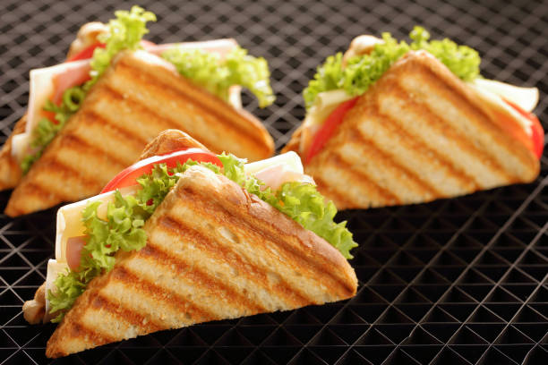 istock Fresh sandwiches with ham and cheese 941797296
