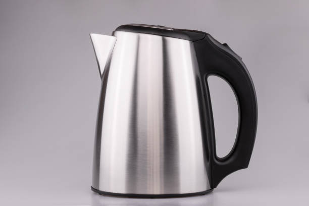 istock Electric stainless steel kettle on clear grey background. 941803690