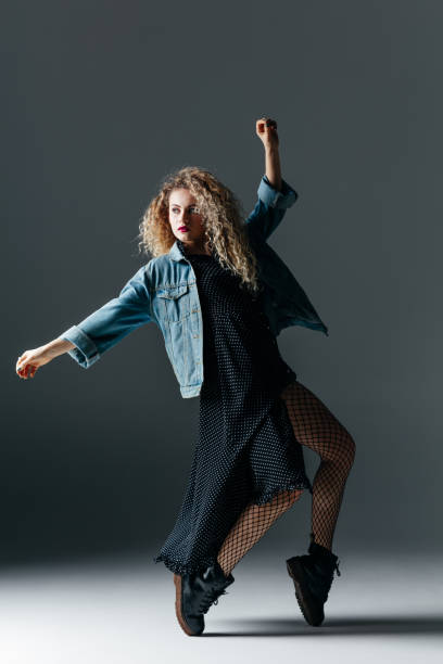 istock Young beautiful female dancer is posing in the studio 941806976
