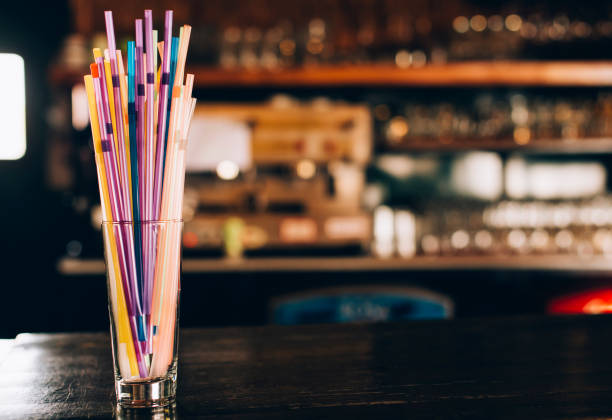 istock Glass with  drink straws on the bar 941811532