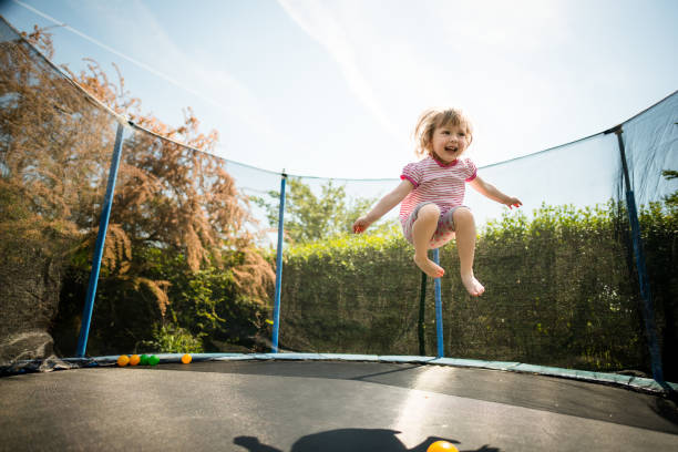 Joy - jumping trampoline stock photo