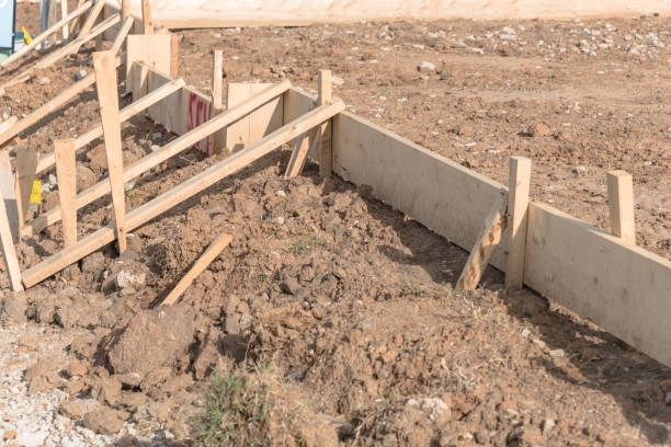 istock Wooden formwork concrete strip foundation for a new house 941818604