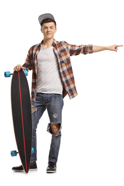 istock Teenage hipster with a longboard pointing 941821050