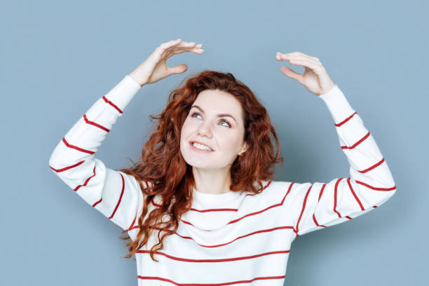 istock Happy nice woman looking at her hands 941825350