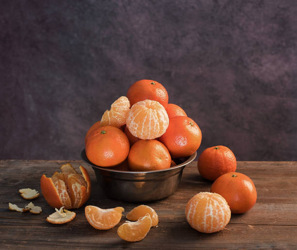 istock Fresh mandarins and peeled mandarins 941830834