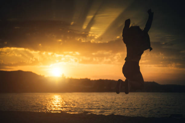 istock Jump of joy at sunset. 941838204
