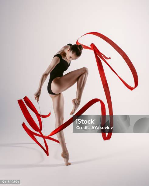 Young Gymnast Woman Stretching And Training Stock Photo - Download Image Now - Gymnastics, Rhythm, Women