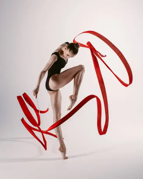 Flexible female doing acrobatic exercises
