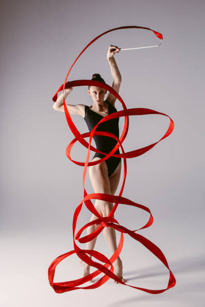 istock Young gymnast woman stretching and training 941841766