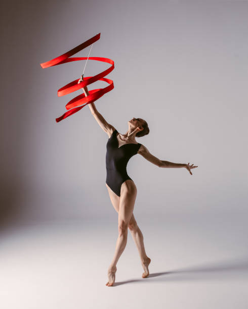 istock Young gymnast woman stretching and training 941842018