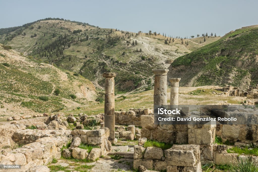 Pella ruins columns near the mountains Pella ruins columns near the mountains, Jordan Jordan - Middle East Stock Photo