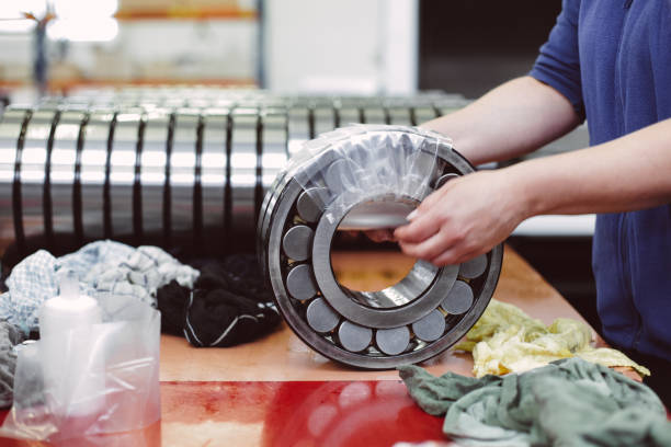 Industrial barrel bearing being wrapped stock photo