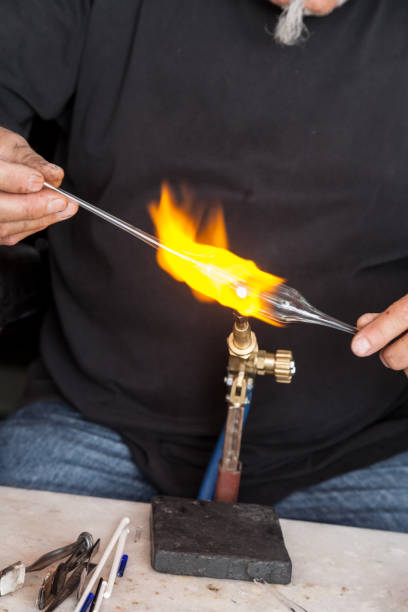 istock glassblower man makes  souvenirs from glass 941843140