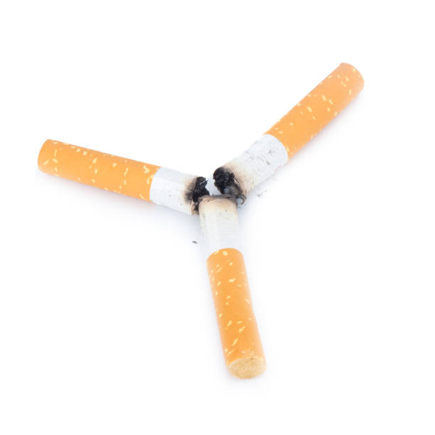 cigarette butt. three. isolated on white background - cigarette smoking ashtray tobacco imagens e fotografias de stock