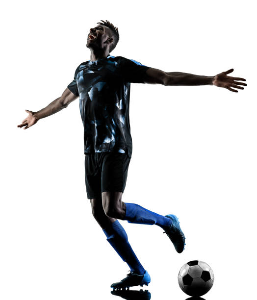 istock one african soccer player man isolated white background silhouet 941847200