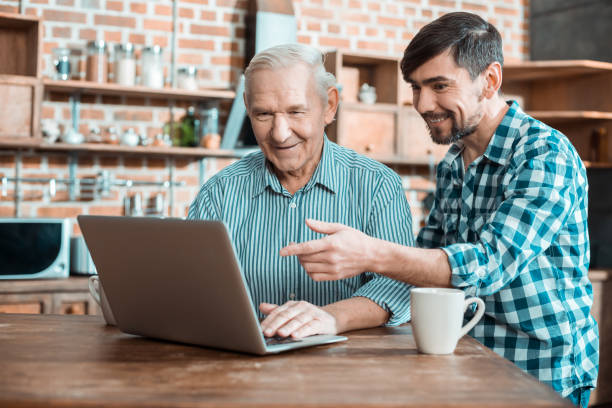 istock Nice handsome man pointing at the laptop screen 941851888