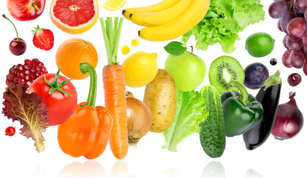 istock Falling of fruits and vegetables on white background 941852304