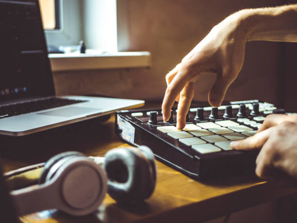 istock creating music in the home studio with controller laptop and headphones 941852672