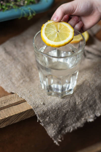 istock a glass of water with lemon (a slice of lemon in pure water) 941855288