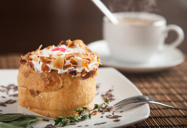 Delicious puff pastry and a fresh coffee with steam