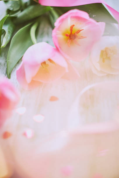 istock Pink tulips on table, bokeh, defocused lights 941859278