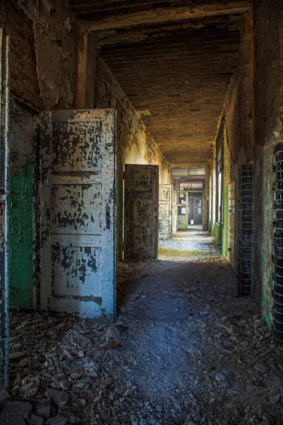 istock A long corridor with many open doors of a lost place 941859754