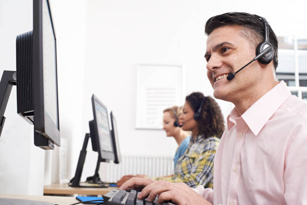 istock Male Customer Services Agent In Call Centre 941862140