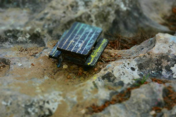 istock A miniature wooden bench in nature 941862508