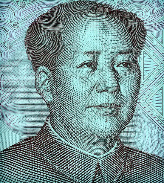 Photo of Portrait of Mao Zedong macro on Chinese banknote. Toned image